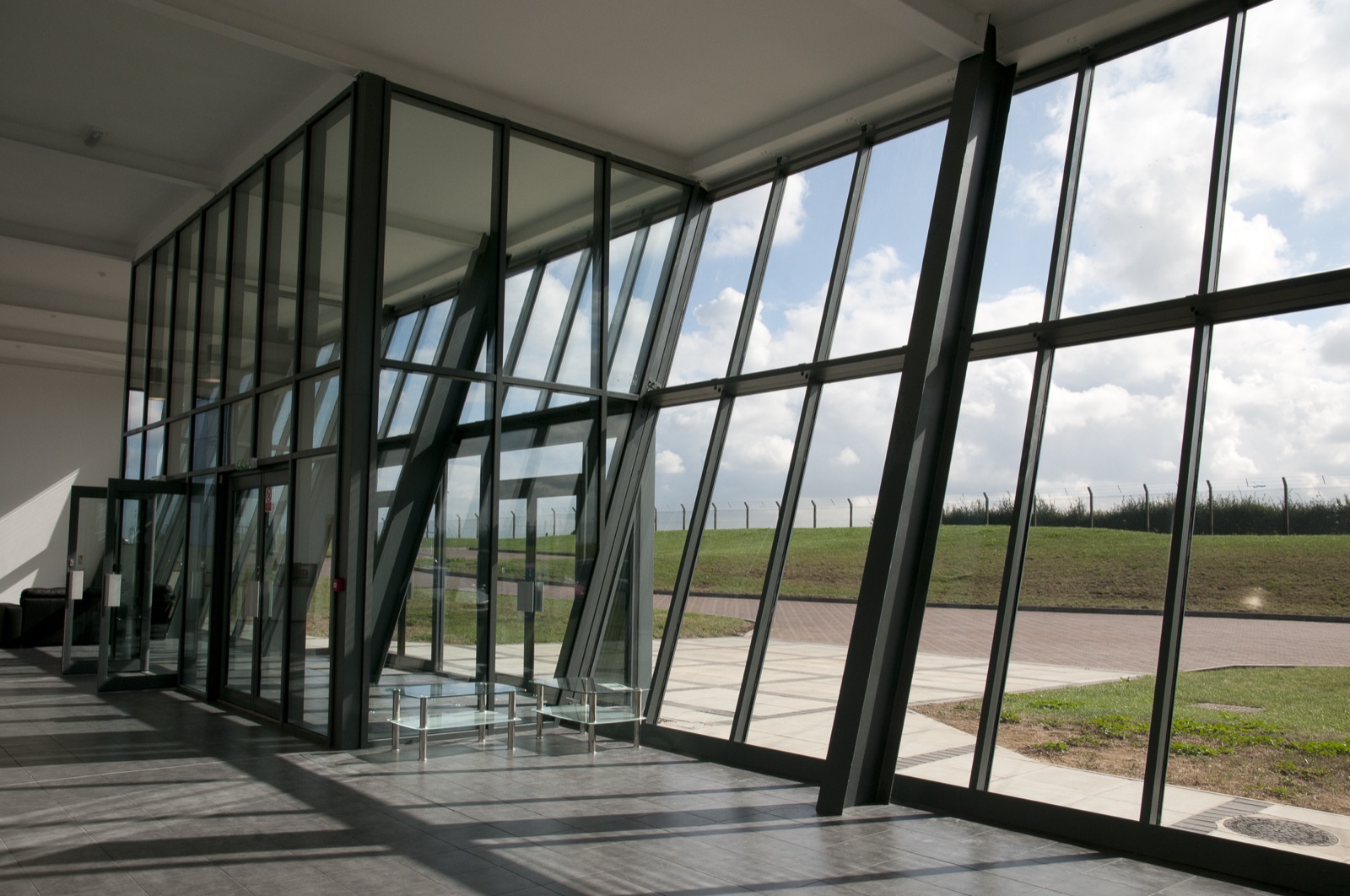 Curtain walling and glazed screens to a commercial building